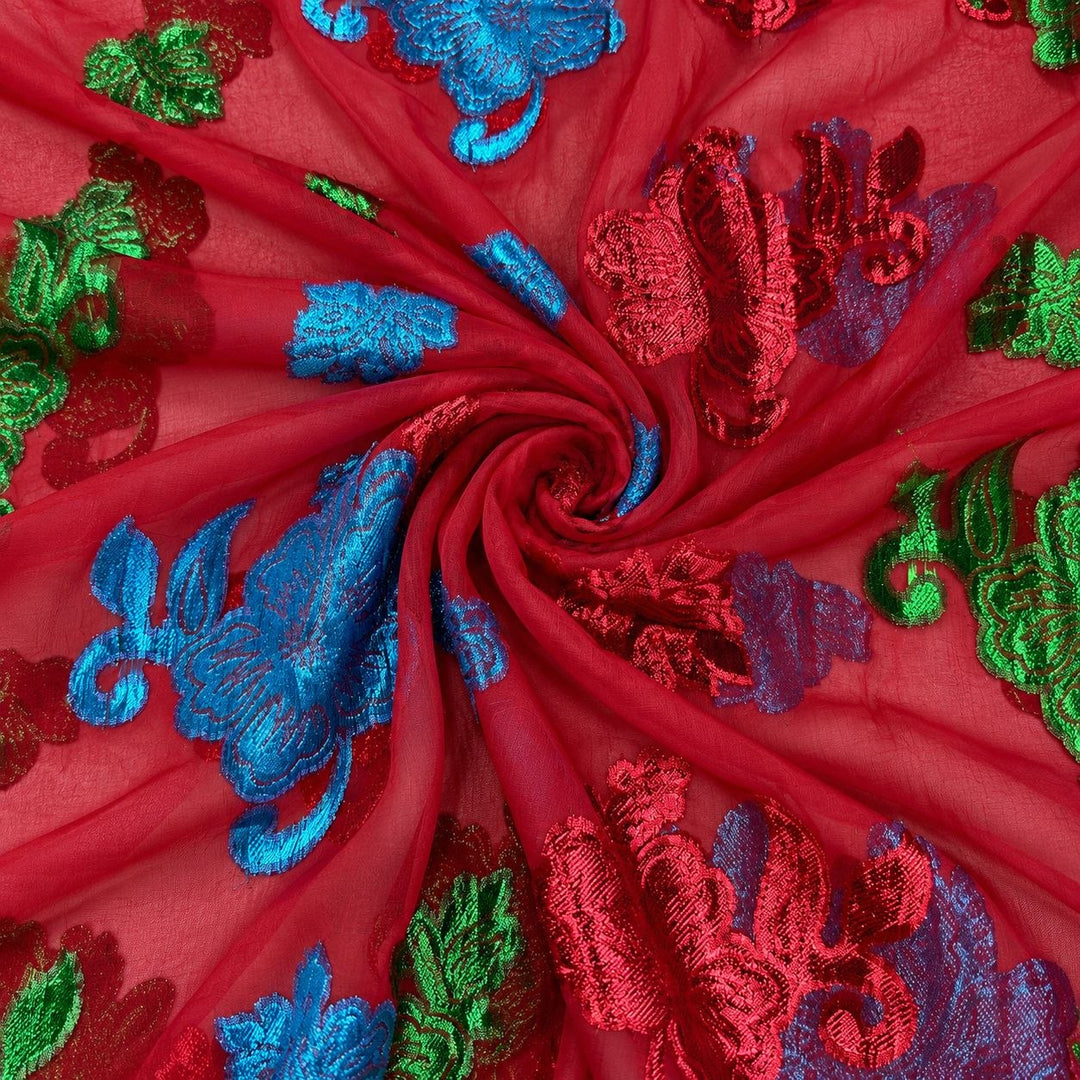 Röd lurex chiffonsilk med färggrika blomstermotiv – tyget format som en spiral (bild 1 av 3)