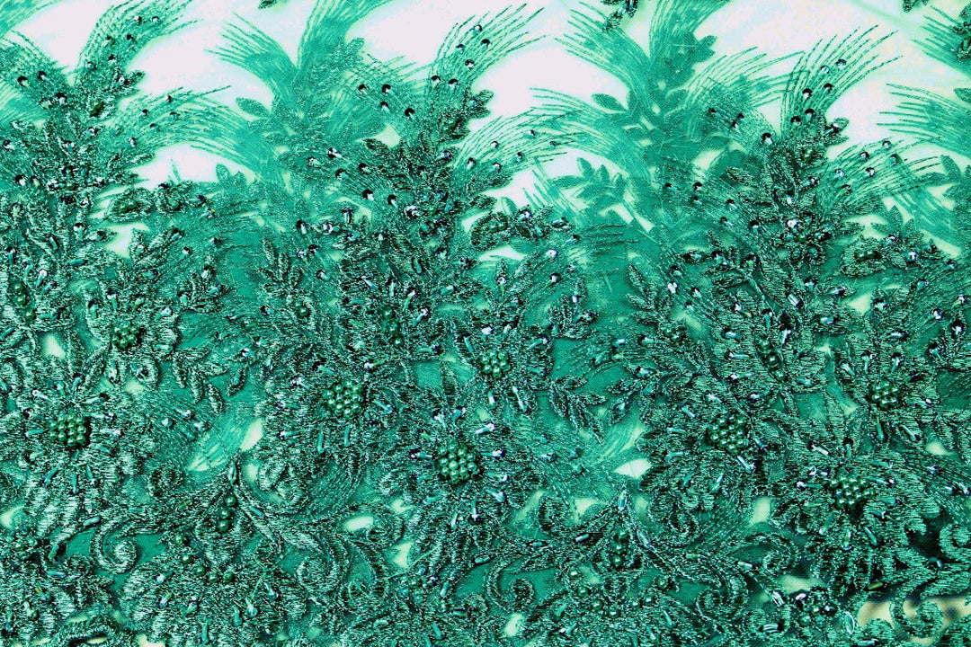 TURKOS TYLLTYG MED PALJETTER OCH PÄRLOR