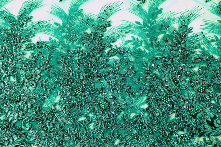 TURKOS TYLLTYG MED PALJETTER OCH PÄRLOR