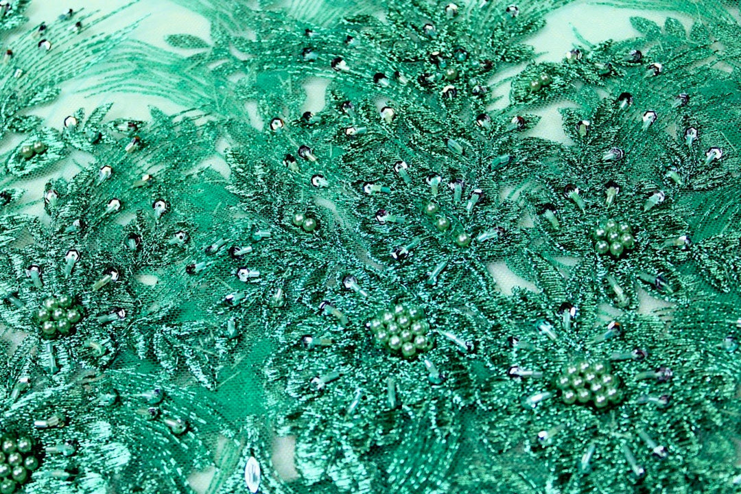 TURKOS TYLLTYG MED PALJETTER OCH PÄRLOR