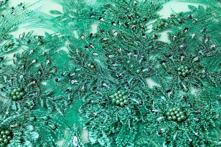 TURKOS TYLLTYG MED PALJETTER OCH PÄRLOR