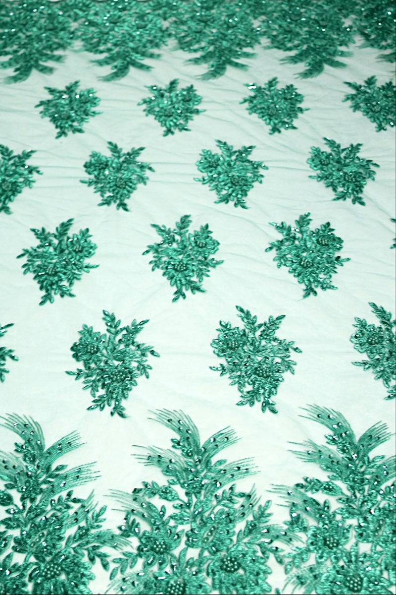 TURKOS TYLLTYG MED PALJETTER OCH PÄRLOR