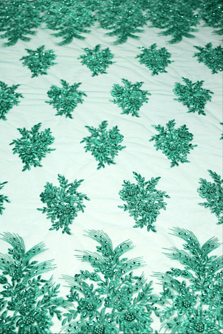 TURKOS TYLLTYG MED PALJETTER OCH PÄRLOR