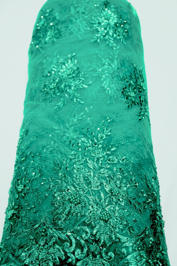 TURKOS TYLLTYG MED PALJETTER OCH PÄRLOR