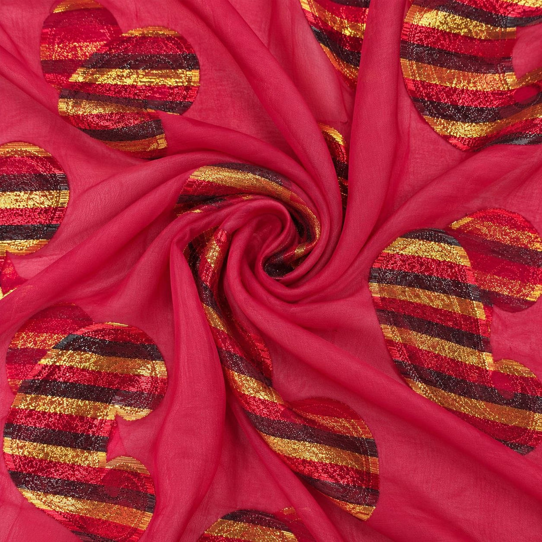 Fuchsia lurex chiffonsilk med flerfärgade randiga paisleymotiv – tyget format som en spiral (bild 1 av 3)