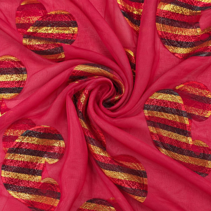 Fuchsia lurex chiffonsilk med flerfärgade randiga paisleymotiv – tyget format som en spiral (bild 1 av 3)