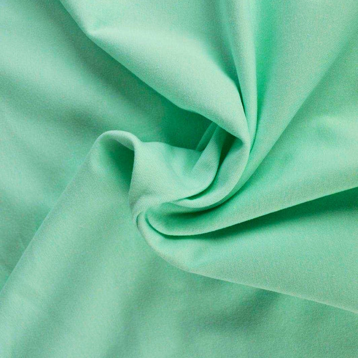 MINTGRÖN BOMULLSJERSEY – NATURLIG, ANDNINGSBAR & STRETCHIG