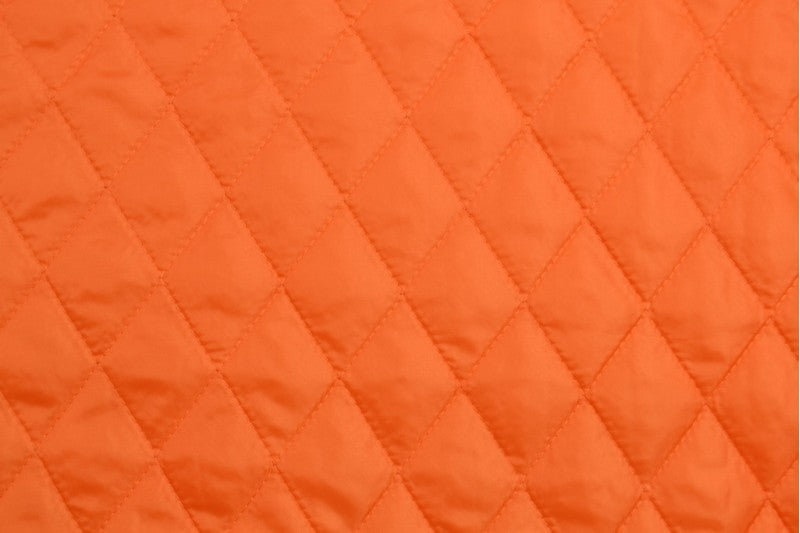 ORANGE QUILTAT TYG MED VADDERAD BAKSIDA