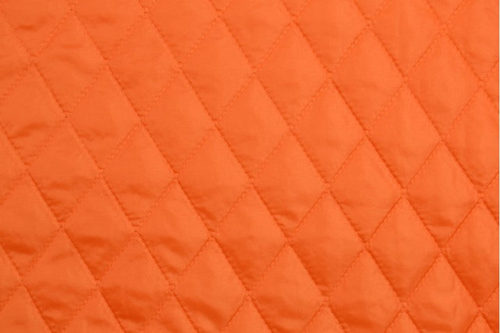 ORANGE QUILTAT TYG MED VADDERAD BAKSIDA