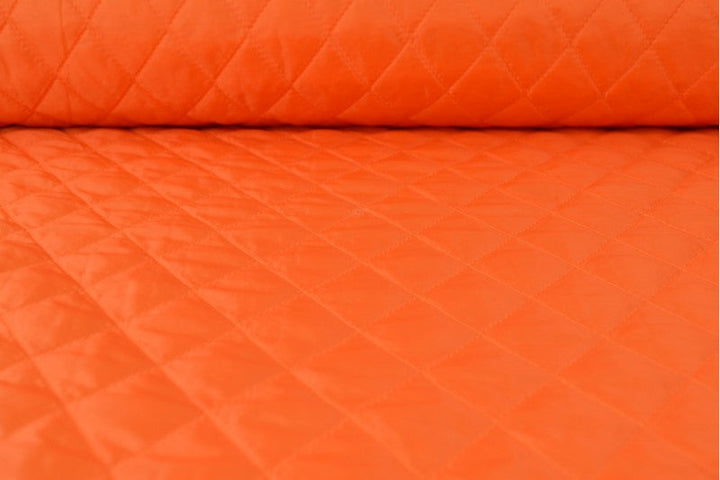 ORANGE QUILTAT TYG MED VADDERAD BAKSIDA