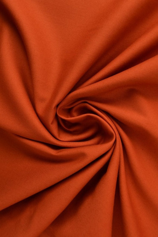 KOPPARFÄRGAD BOMULLSPOPLIN – TÄTT VÄVT BOMULLSTYG