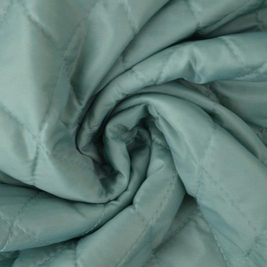 VINTAGE GRÖN QUILTAT TYG MED VADDERAD BAKSIDA