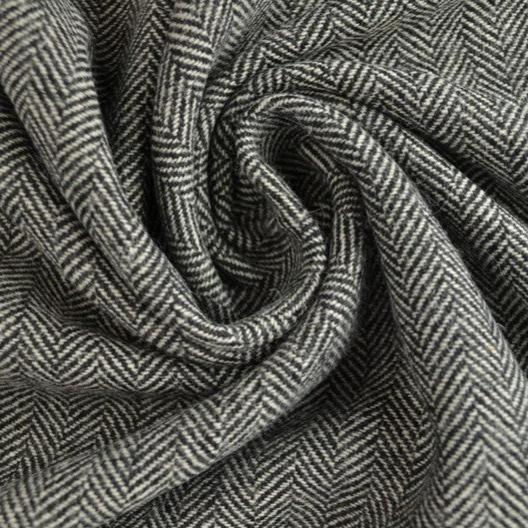 GRÅ YLLETYG MED TWEEDSTRUKTUR OCH SILLBENSMÖNSTER