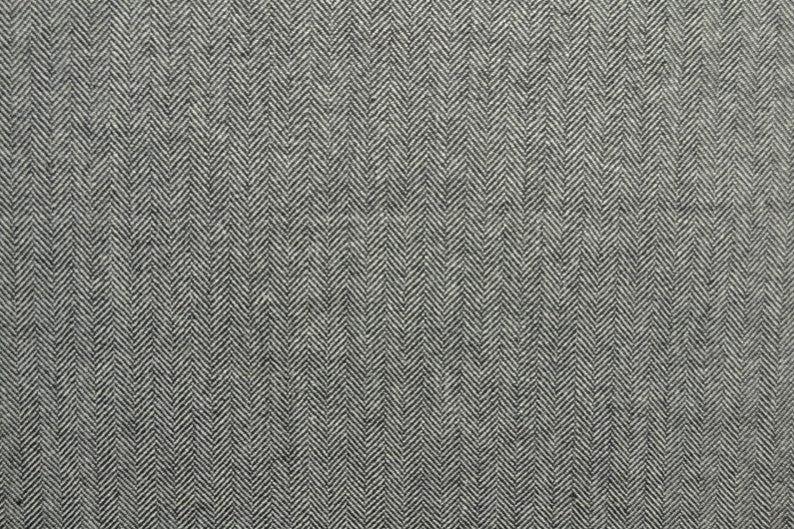 GRÅ YLLETYG MED TWEEDSTRUKTUR OCH SILLBENSMÖNSTER