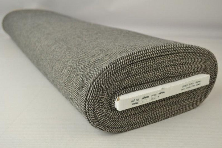 BEIGE YLLETYG MED TWEEDSTRUKTUR OCH SILLBENSMÖNSTER